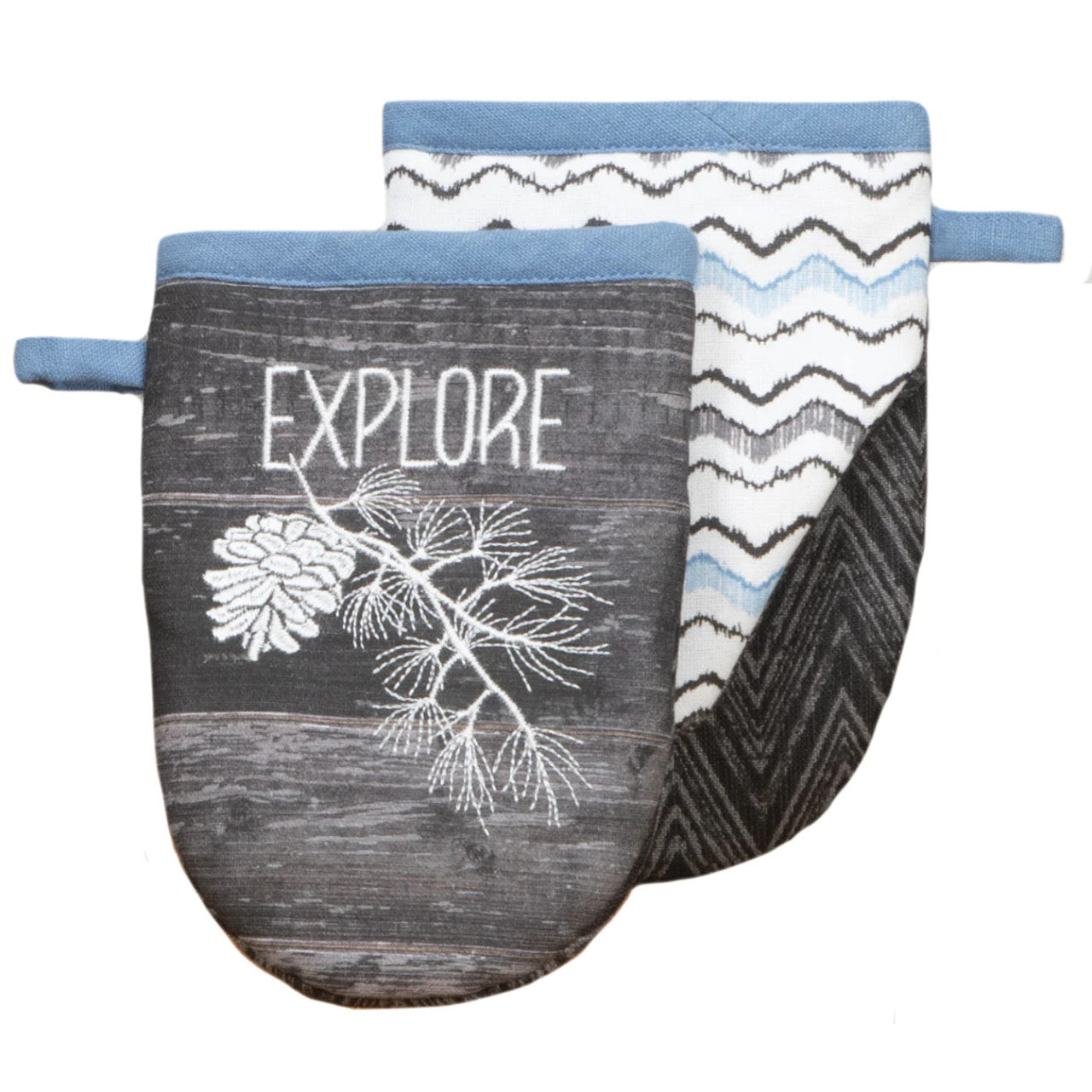 Grey oven mitt with white image of branch and pine cone, and 'Explore' in white text on the front, and with zig zag patterns on the back