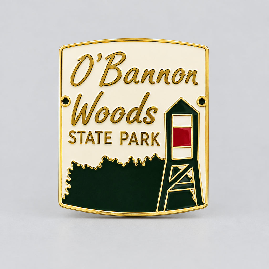 hiking medallion with the words o'bannon woods state park featuring a treeline and fire tower