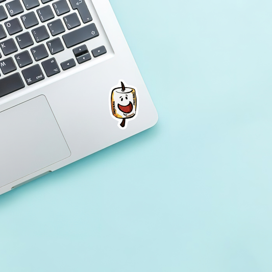 Laptop with a marshmallow character sticker on a light blue background