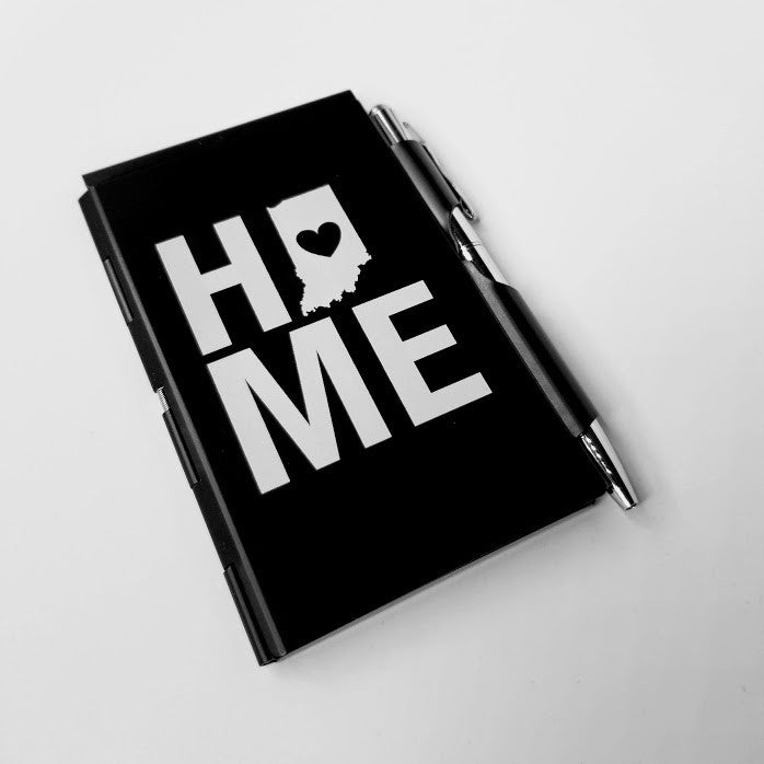 Black notebook with 'HOME' design on a white background