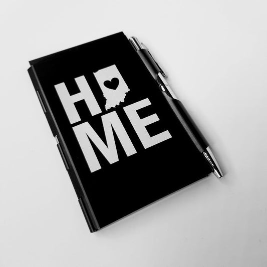 Black notebook with 'HOME' design on a white background
