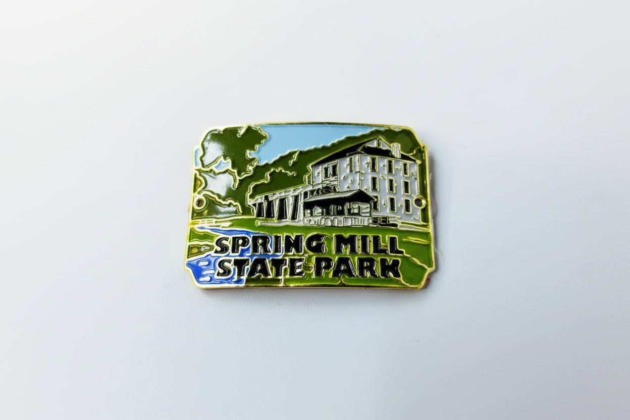 Hiking stick medallion with 'Spring Mill State Park' text and building design on a white background