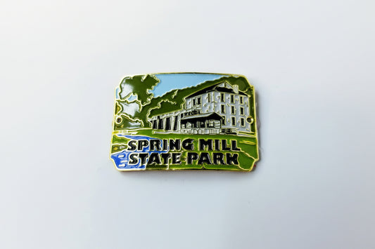 Hiking stick medallion with 'Spring Mill State Park' text and building design on a white background