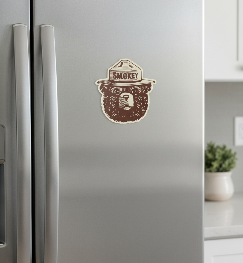 Sticker of a bear wearing a hat with 'Smokey' text on a white background