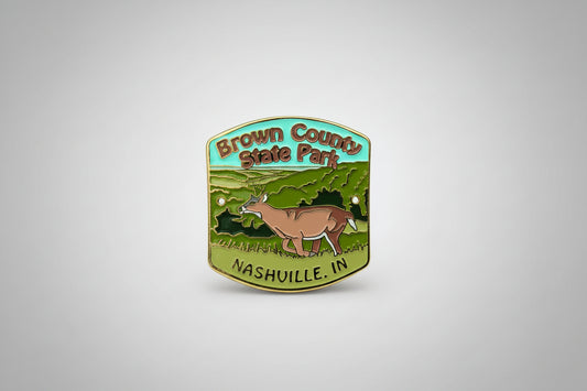Brown County State Park hiking medallion with deer illustration on a woodland background
