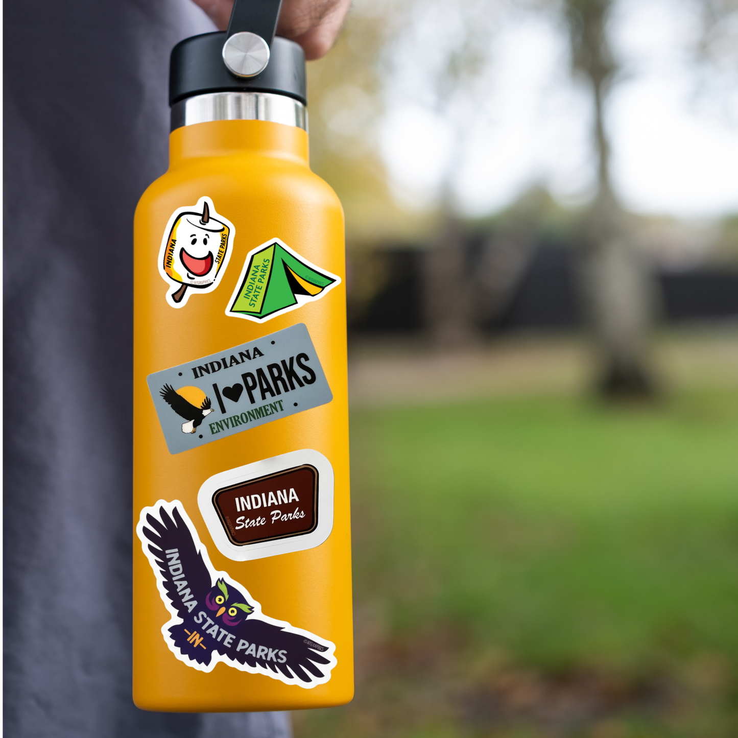 orange water bottle featuring different stickers that say indiana state parks