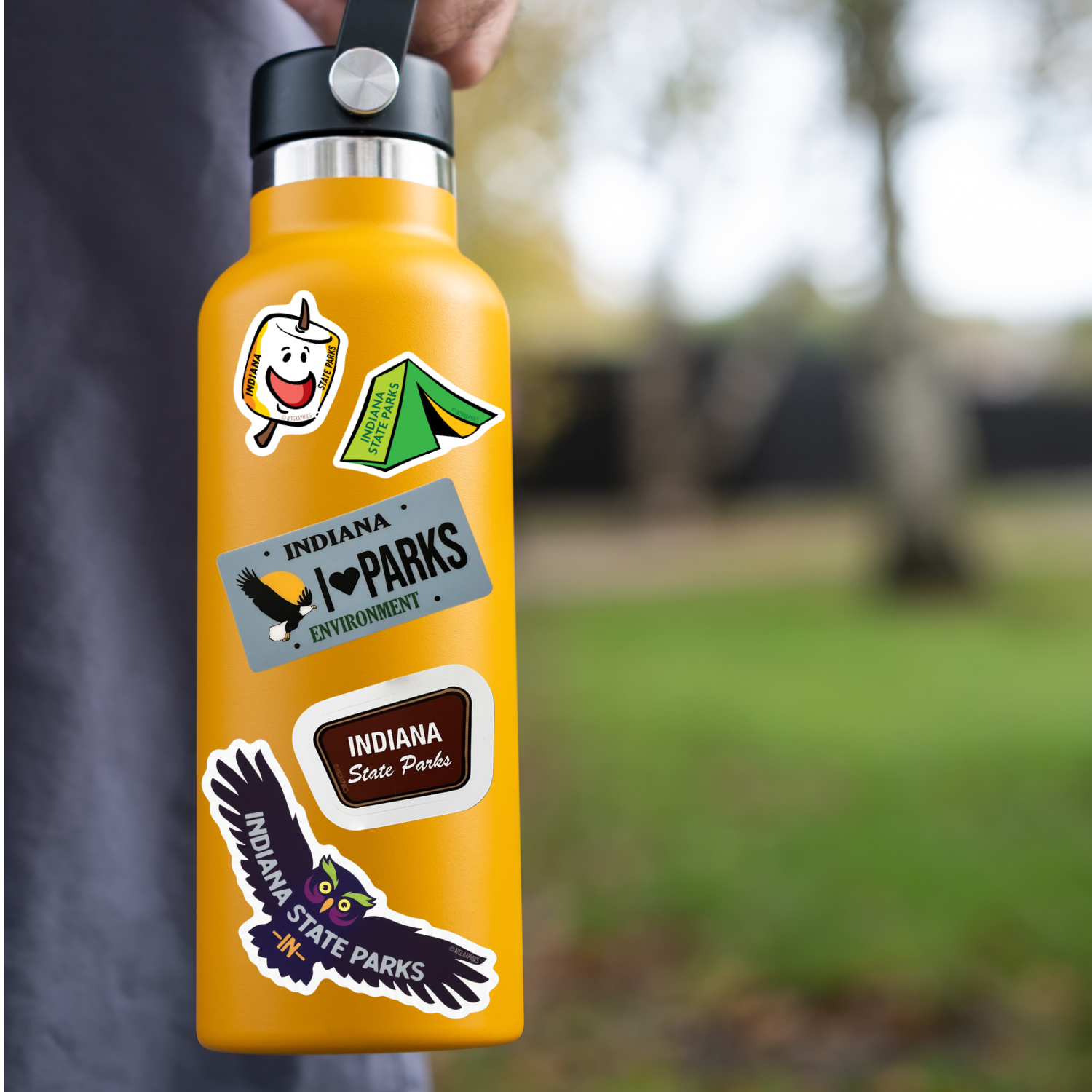 orange water bottle featuring different stickers that say indiana state parks
