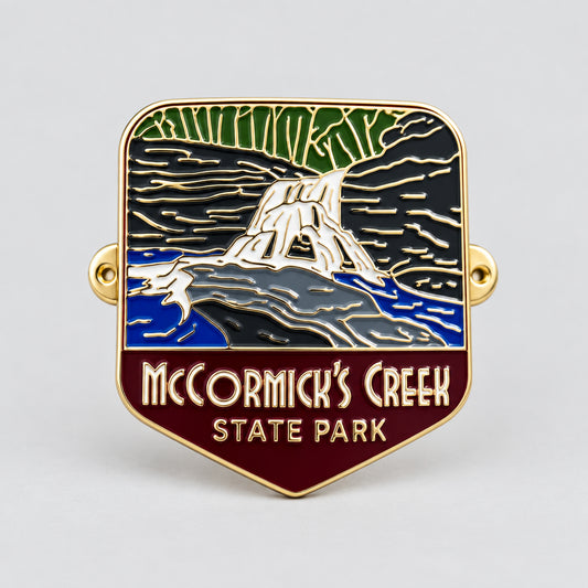 hiking medallion of a waterfall at mccormicks creek state park