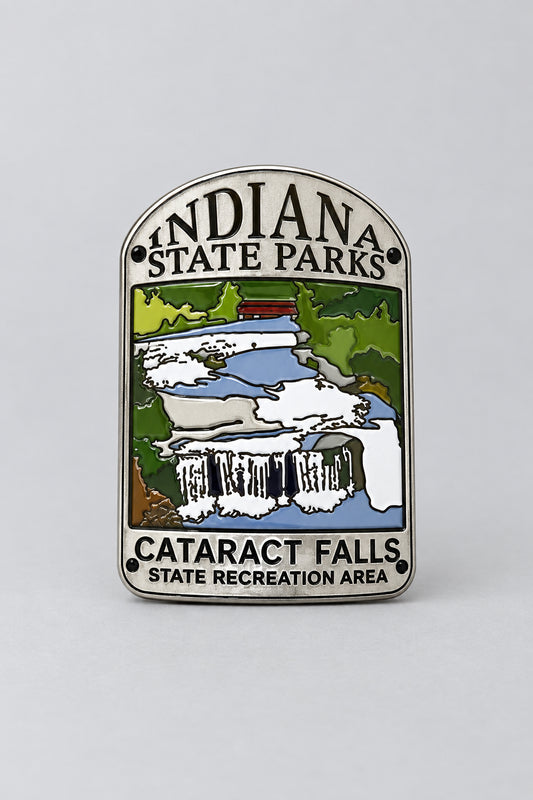 hiking medallion featuring cataract falls state recreation are with a waterfall and trees