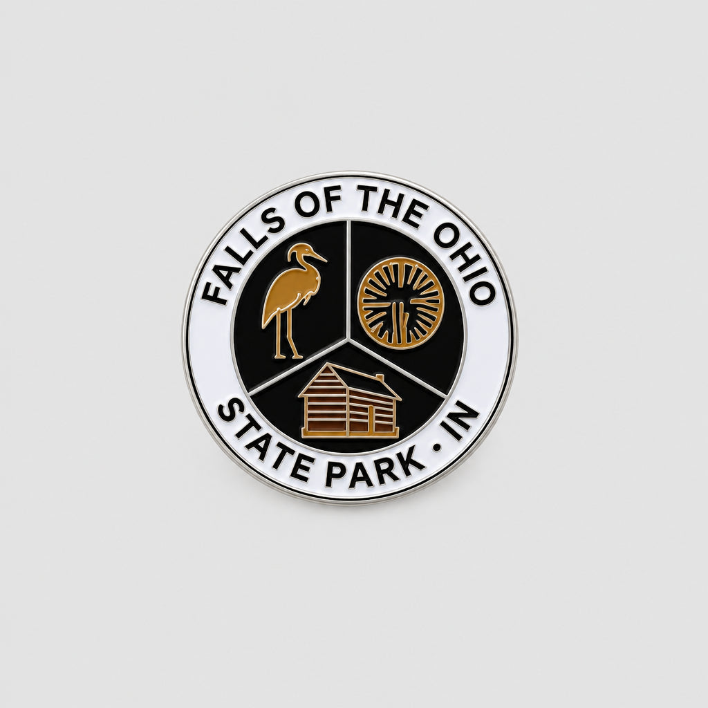 magnet that says falls of the ohio state park and has an image of a heron, fossil, and cabin