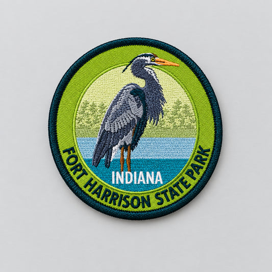 Fort Harrison State Park embroidered patch with heron standing by water on a green and blue circular design