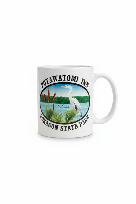 White mug with Potawatomi Inn Pokagon State Park text and image of blue heron
