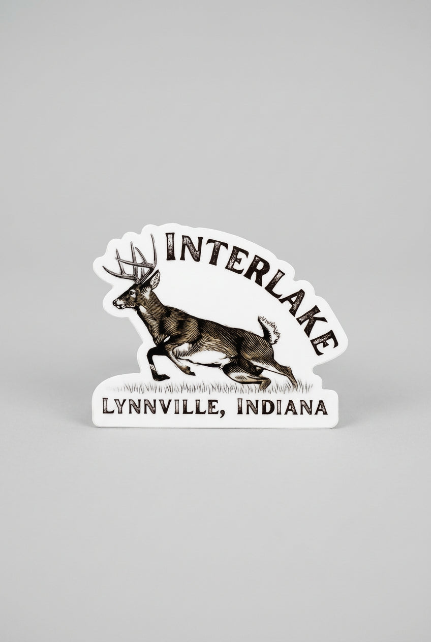 Die‑cut sticker showing an illustrated running deer with the text “Interlake Lynnville, Indiana.”