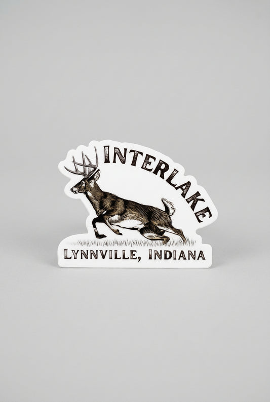 Die‑cut sticker showing an illustrated running deer with the text “Interlake Lynnville, Indiana.”