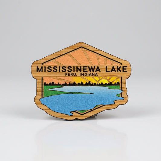 Wood‑style magnet with an illustrated sunrise over Mississinewa Lake, labeled “Mississinewa Lake, Peru, Indiana.”