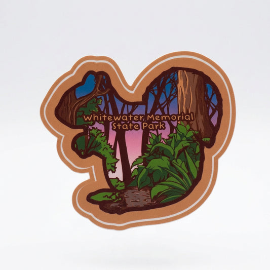 Squirrel‑shaped vinyl sticker with a colorful forest scene and the text “Whitewater Memorial State Park.”