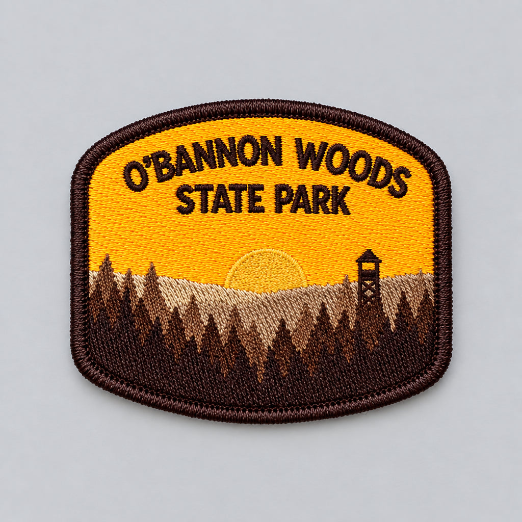 o'bannon woods state park patch featuring a sunset over trees and fire tower