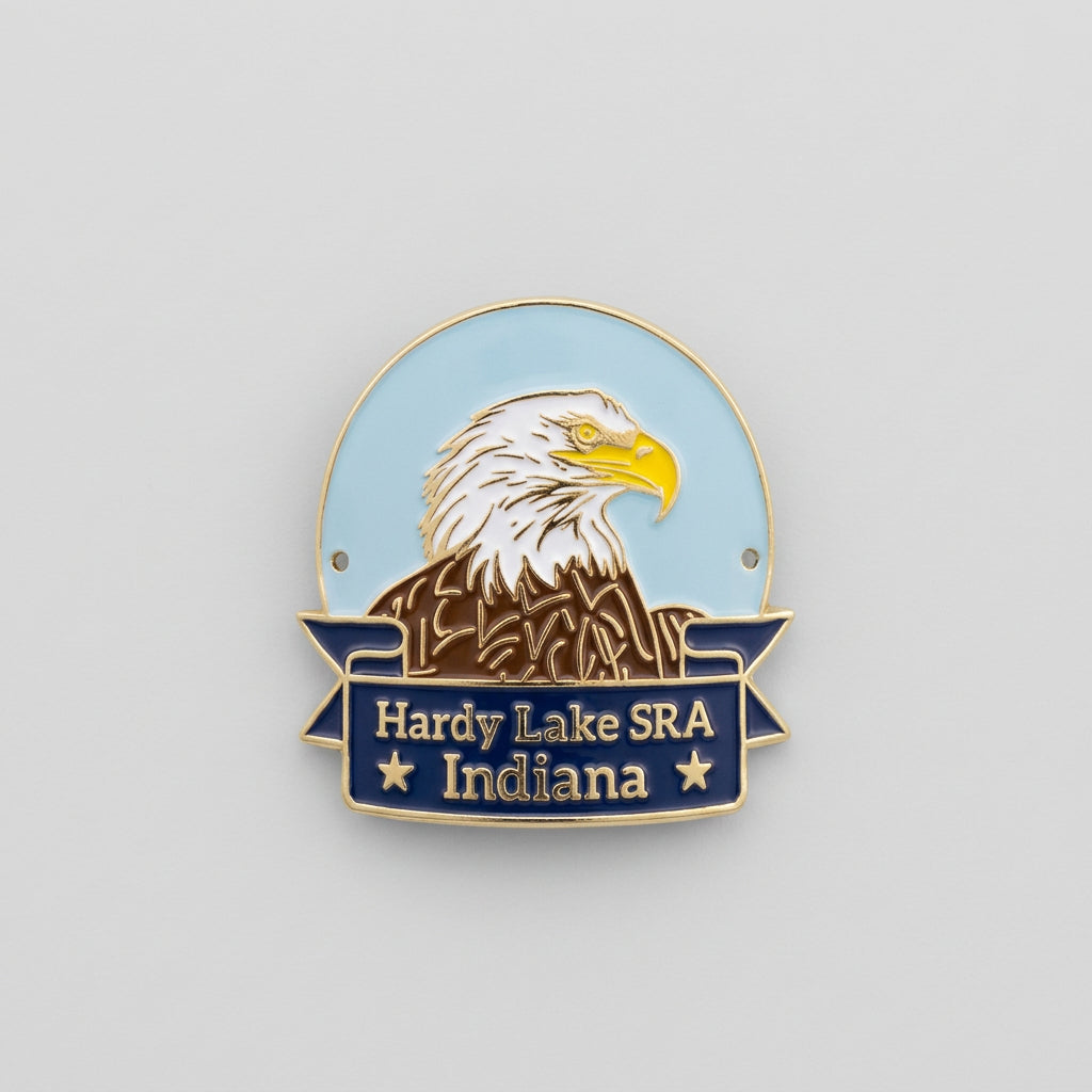 Enamel‑style hiking medallion with an eagle head illustration above a navy banner reading “Hardy Lake SRA Indiana.”