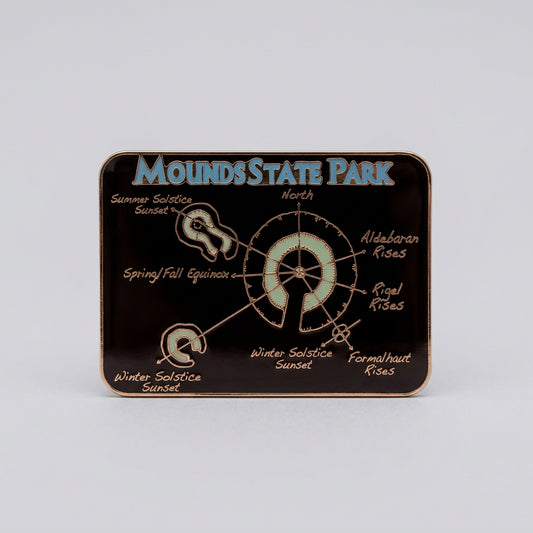 Rectangular metallic magnet showing a gold‑lined diagram of Mounds State Park earthworks with labeled solstice and star alignments, titled “Mounds State Park.”