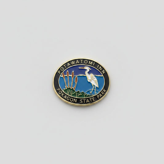 Hiking stick medallion with a heron design and 'Potawatomi Inn: Pokagon State Park'