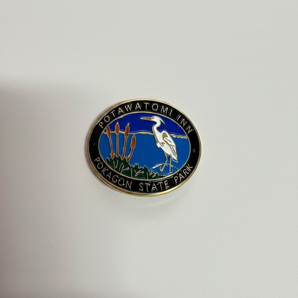 Hiking stick medallion with a heron design and 'Potawatomi Inn: Pokagon State Park'