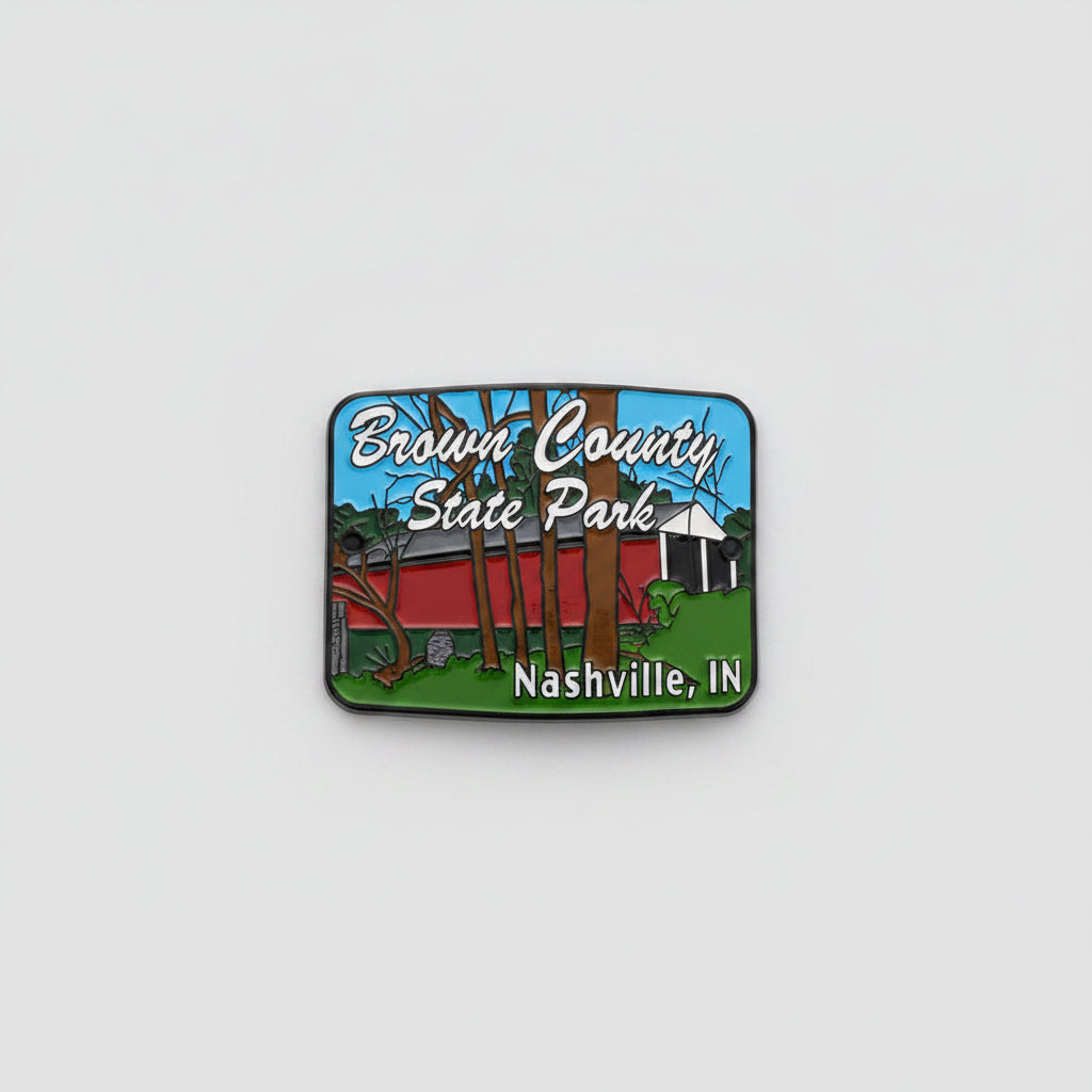 Hiking stick medallion with red covered bridge and "Brown County State Park' in text