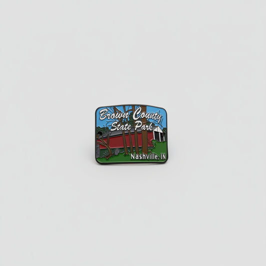 Hiking stick medallion with red covered bridge and "Brown County State Park' in text