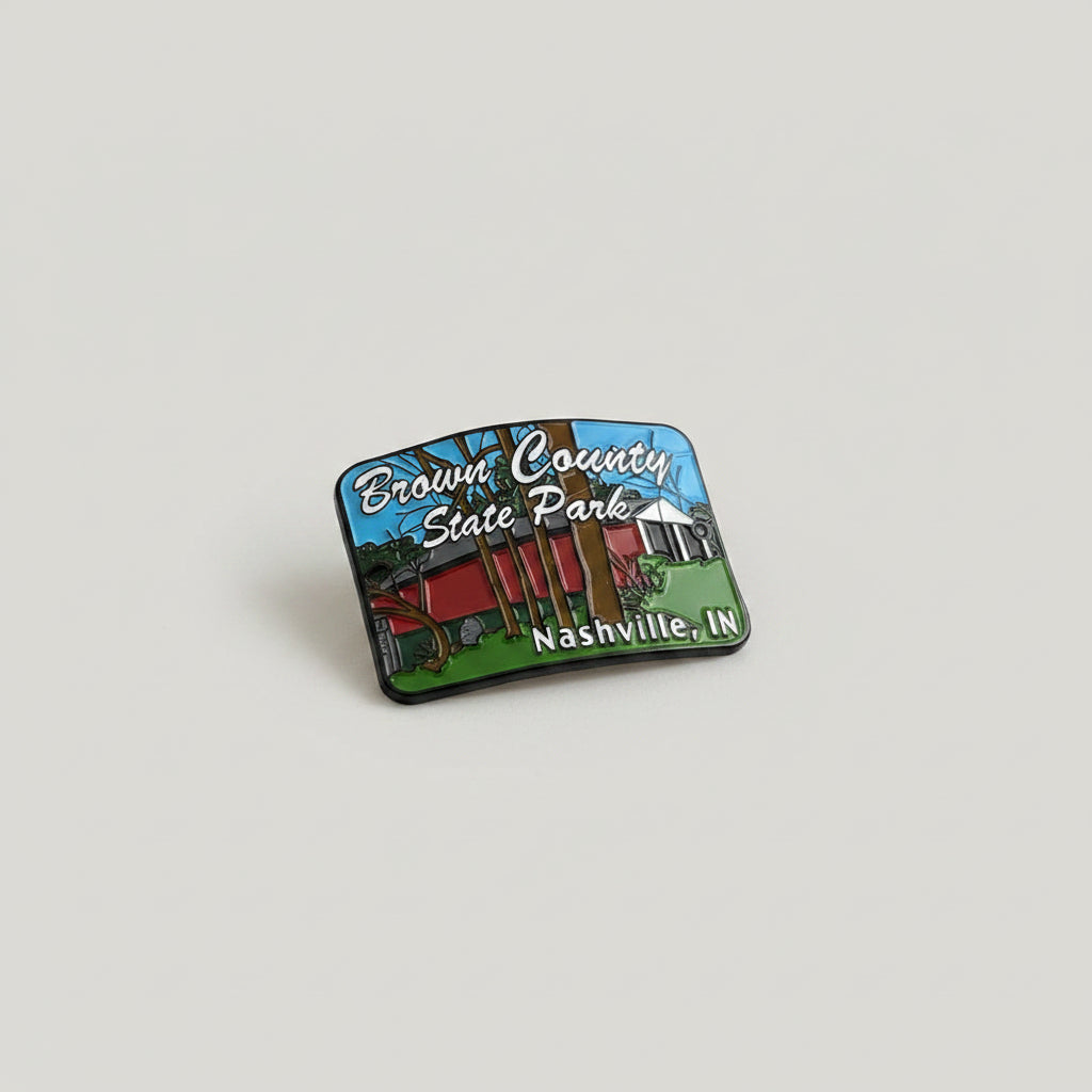 Hiking stick medallion with red covered bridge and "Brown County State Park' in text