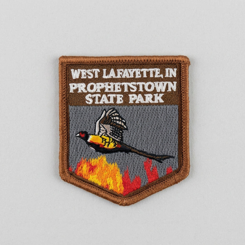 Embroidered patch with a flying bird above stylized flames and the text “West Lafayette, IN Prophetstown State Park.”