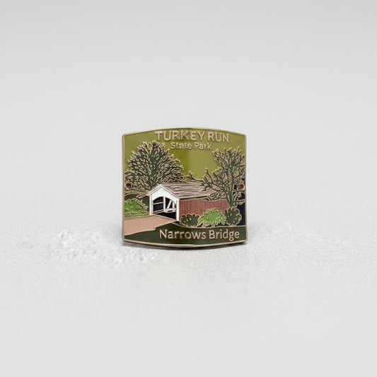 Badge with a bridge illustration and text on a textured gray background