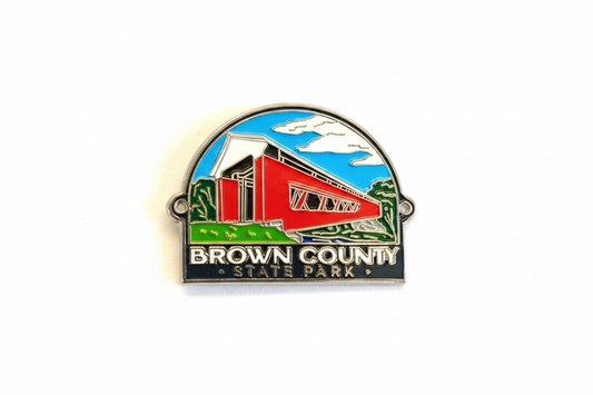 Hiking medallion with a red covered bridge design and 'Brown County State Park' text on a white background