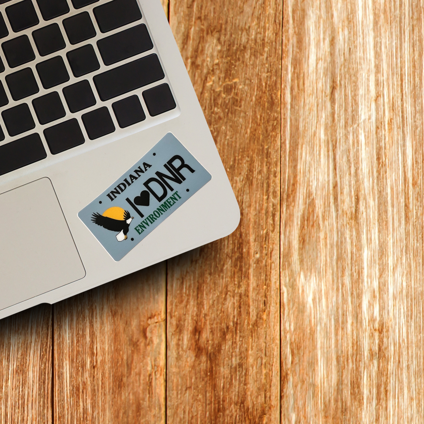 image of a laptop with blue sticker that says indiana I love DNR environment 