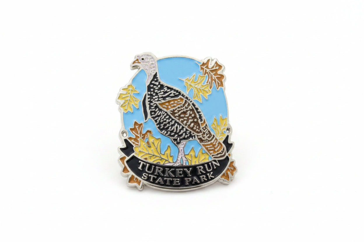 Hiking stick medallion with a turkey design and 'Turkey Run State Park' text on a blue background