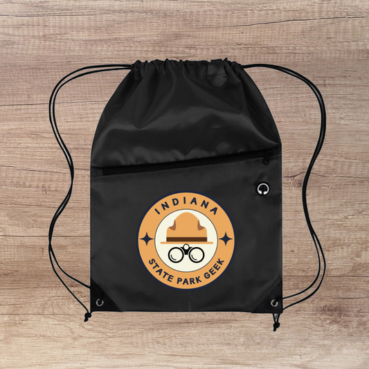 Black drawstring bag with 'Indiana State Park Geek' logo on a wooden surface