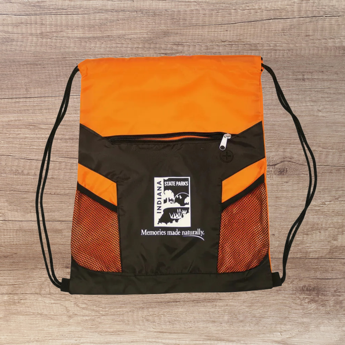 Orange and black drawstring bag with Indiana State Parks logo on a wooden surface
