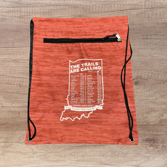 red and black drawstring bag with Indiana State Parks logo on a wooden surface
