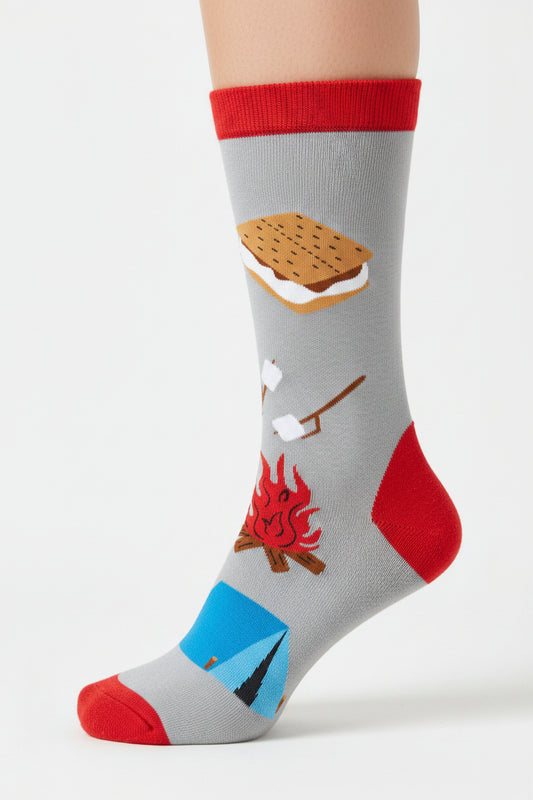 Sock with camping-themed design including a campfire, tent, marshmallow, and graham cracker on a gray background.