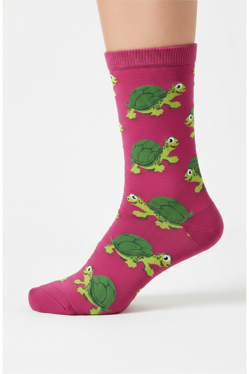 Pink sock with green turtle pattern