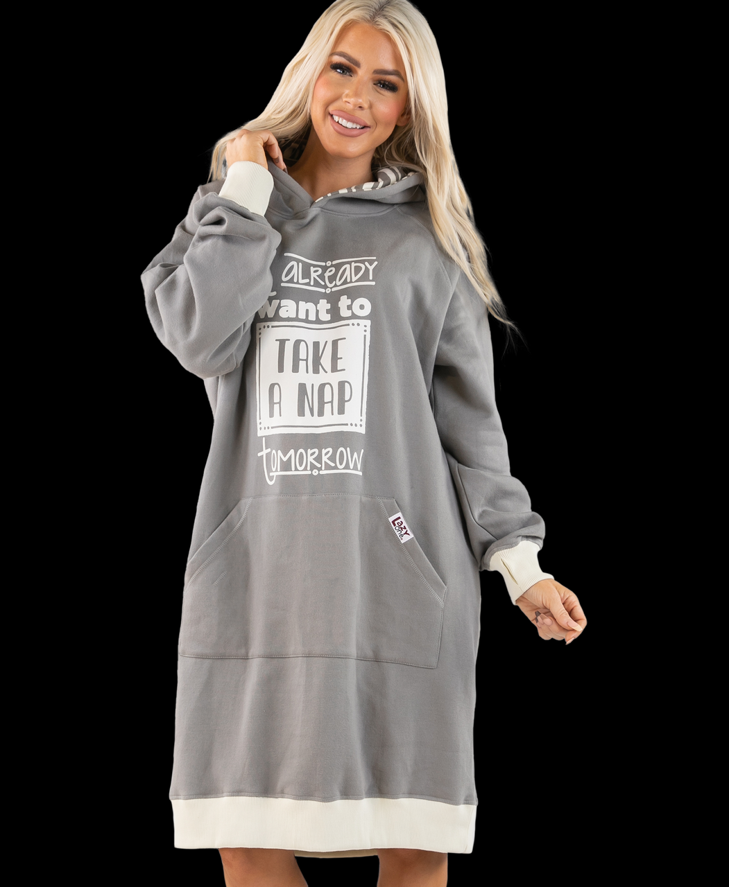 Woman wearing a gray hoodie dress with text on a black background