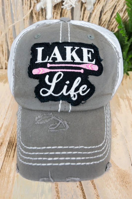 Gray cap with 'Lake Life' text on a wooden surface
