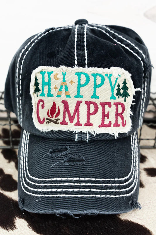 Distressed black cap with 'Happy Camper' text and camp graphics on a patch