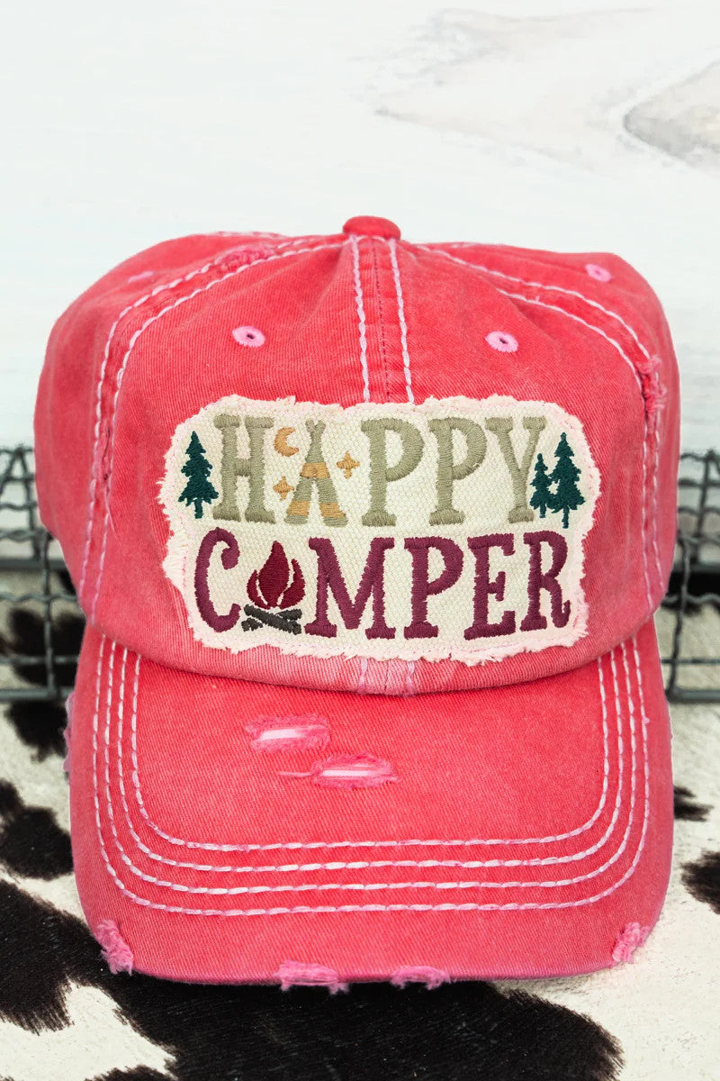 Distressed salmon pink cap with 'Happy Camper' text and camp graphics on a patch