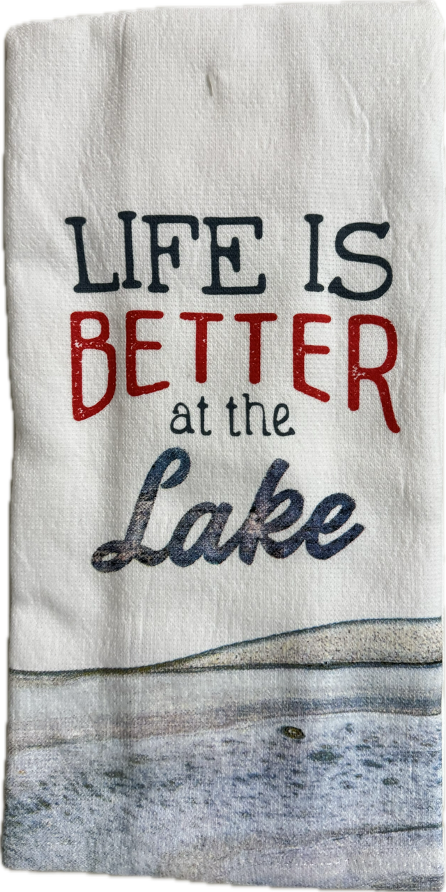 Tea towel with 'Life is Better at the Lake' text and lake scene design.