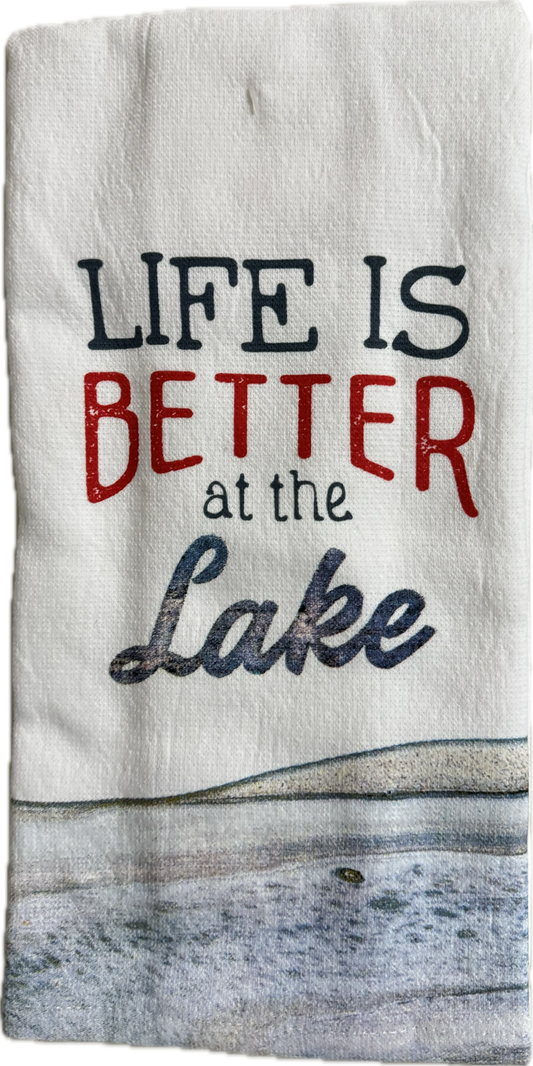 Tea towel with 'Life is Better at the Lake' text and lake scene design.