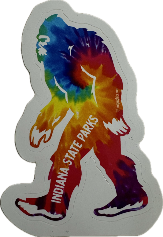 Colorful tie-dye bigfoot-shaped sticker with 'Indiana State Parks' text on a white background